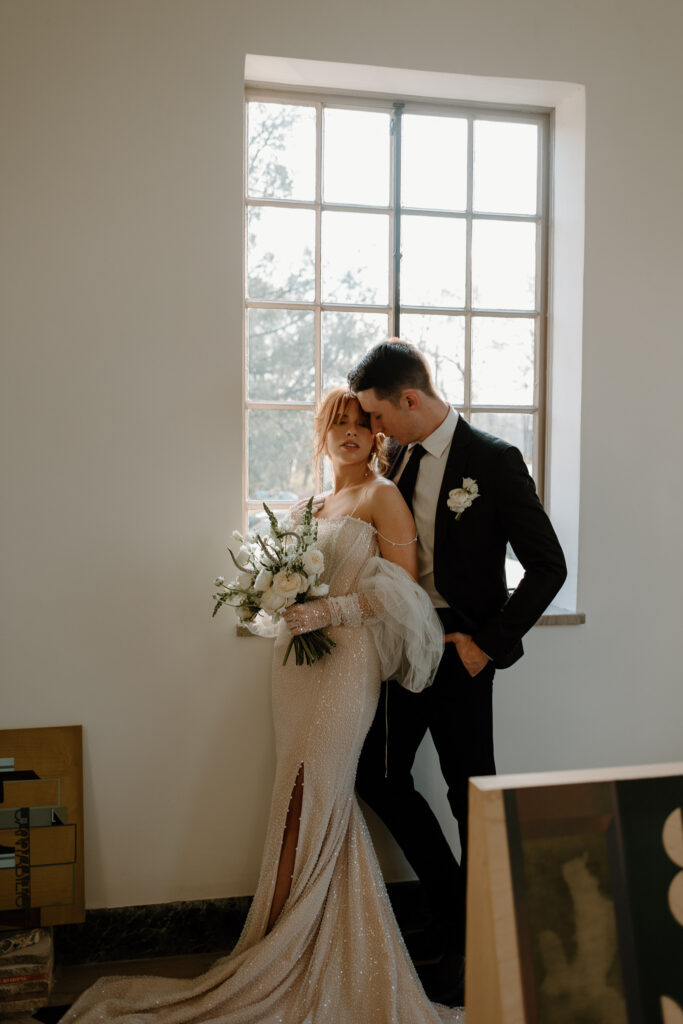 Intimate bride and groom portraits at art gallery and micro wedding venue in Knoxville, Tennessee.