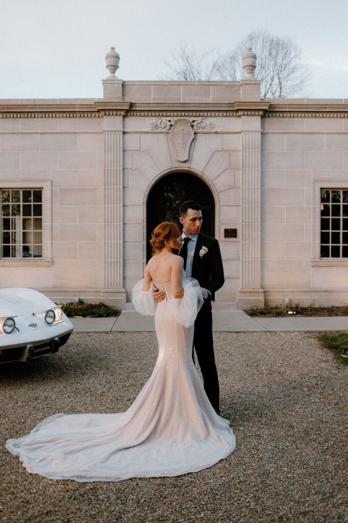 Bride and groom pose in front of micro wedding venue in Knoxville, Tennessee.