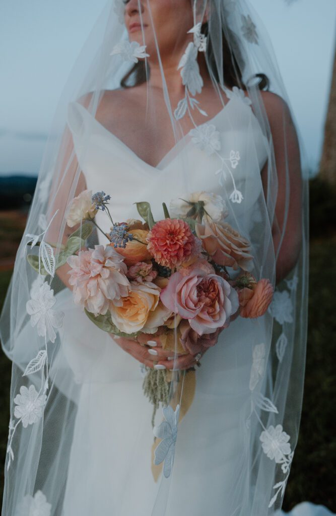 Artys bridal portrait of bride and her summer color bouquet.