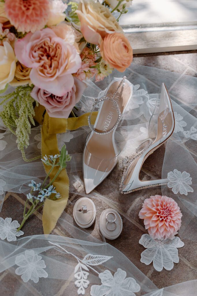 Colorful pastel summer wedding bouquet and bridal details. 