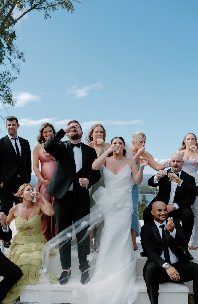 Fun wedding party photo ideas. Bridal party takes a shot of Tequila together. 
