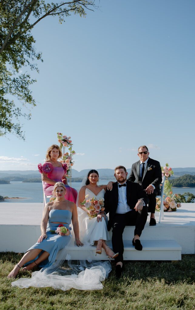Family formals during colorful summer backyard wedding.