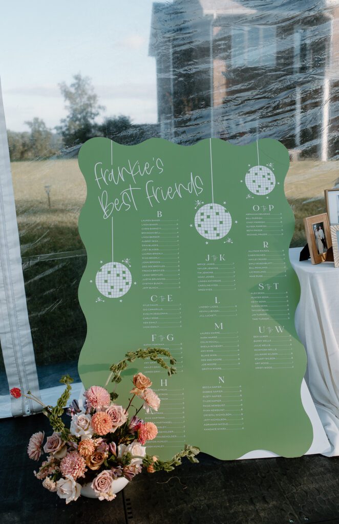 Custom made seating chart for wedding reception for colorful backyard wedding.