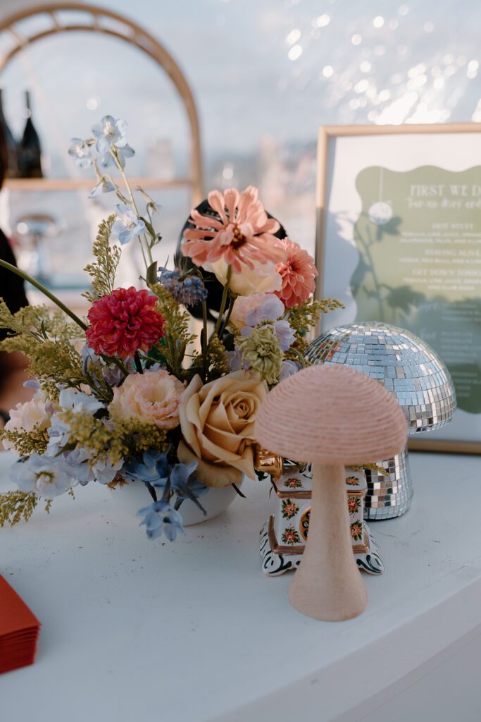 Wedding reception bar decor for a colorful backyard wedding.
