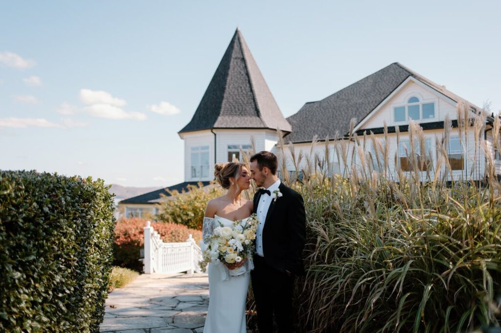 Couple pose in front of Whitestone Inn, an east Tennessee wedding venue.