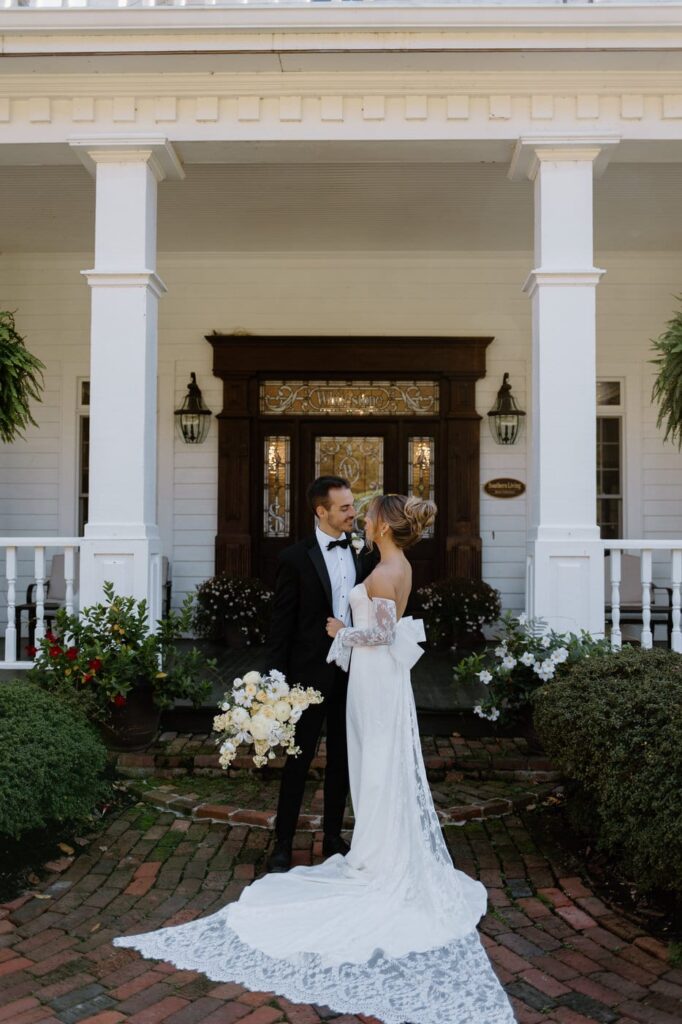 Classic bride and groom pose for bridal portraits at Whitestone Inn, an east Tennessee wedding venue.