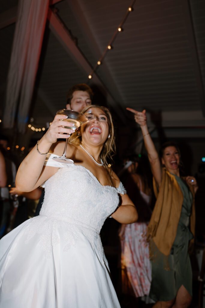 Candid moments of the bride enjoying her wedding reception at CJ's Off the Square, a Nashville Wedding Venue. 