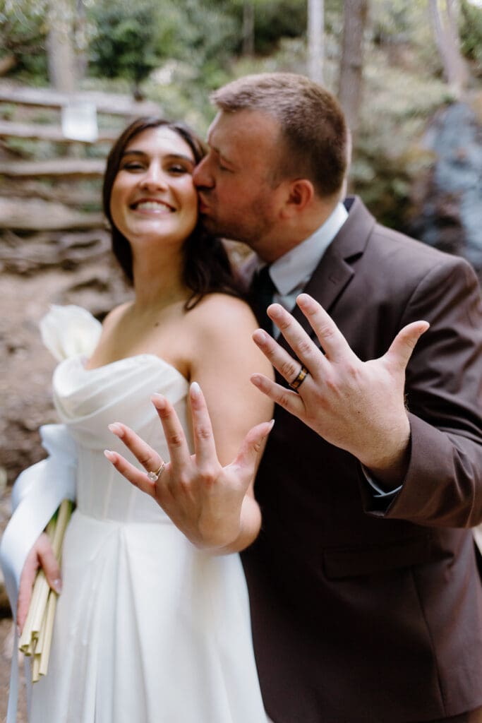 Bride and groom showing off their "just married" excitement during their summer elopement in the Smokies.