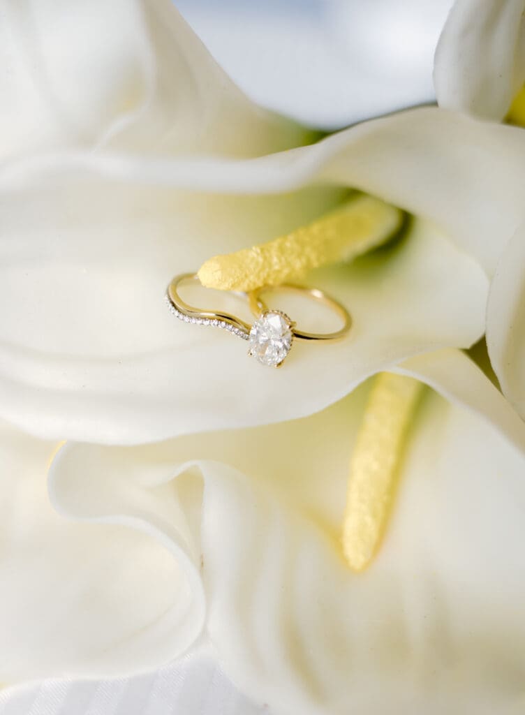 Stunning ring detail photo with a lily wedding bouquet for a summer elopement in the Smokies.