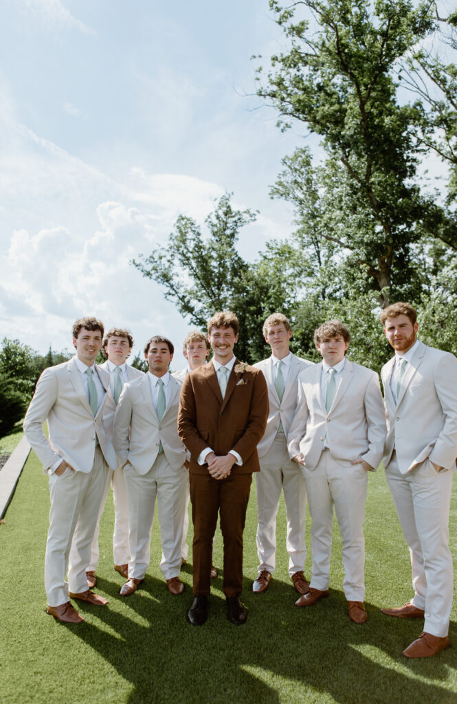 Summer garden wedding attire for the groom and his groomsmen at Nichols Heir wedding venue in Tennessee.