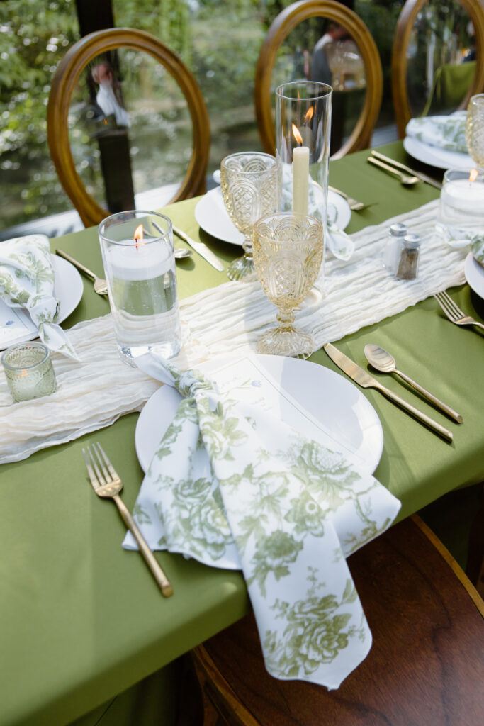 Reception place settings for a summer garden themed wedding.