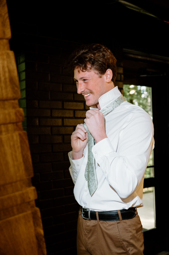 Groom getting ready Nichols Heir Summer Garden Wedding in Sevierville, TN