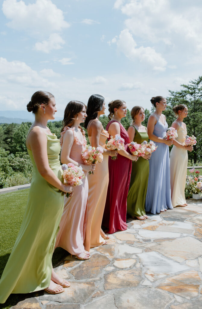 Colorful mismatched bridesmaid dresses at Nichols Heir Summer Garden Wedding in Sevierville, TN