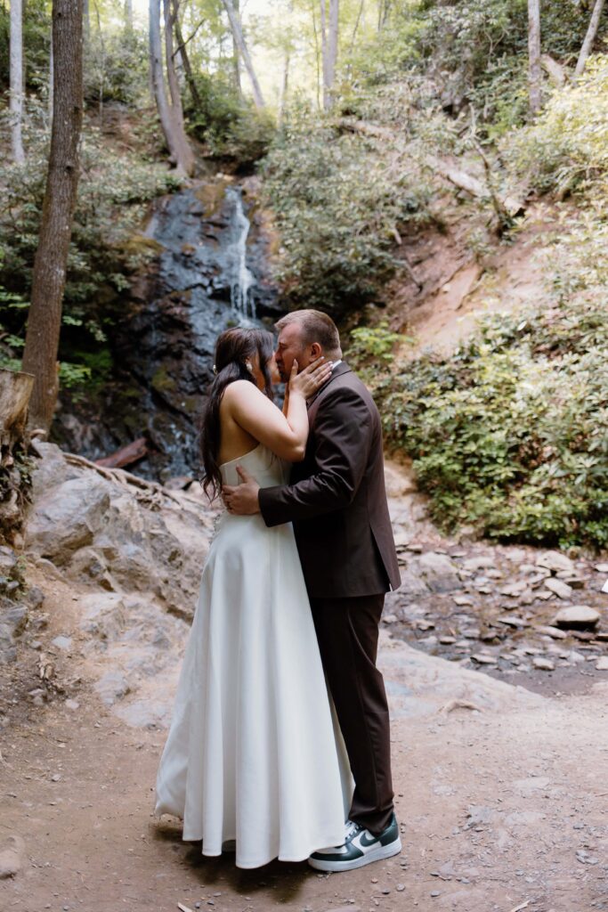 First kiss at Cataract Falls captured by Tennessee elopement photographer.