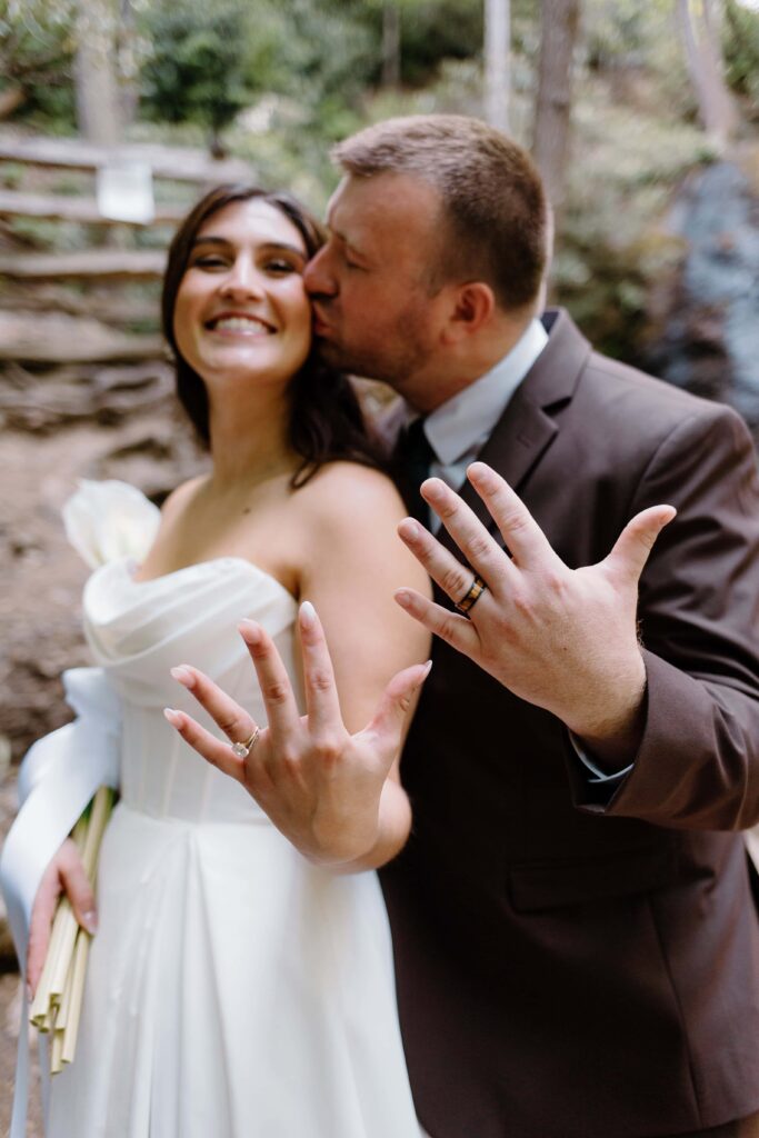 Bride and groom showing off their "just married" excitement during their summer elopement in the Smokies. Captured by Tennessee elopement photographer.