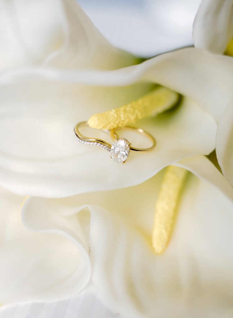 Stunning ring detail photo with a lily wedding bouquet for a summer elopement in the Smokies.