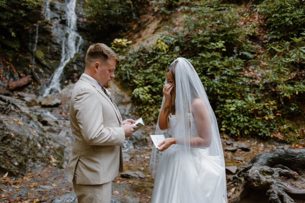 During a couple's vows, the bride show tearful emotion during this Great Smoky Mountain elopement.