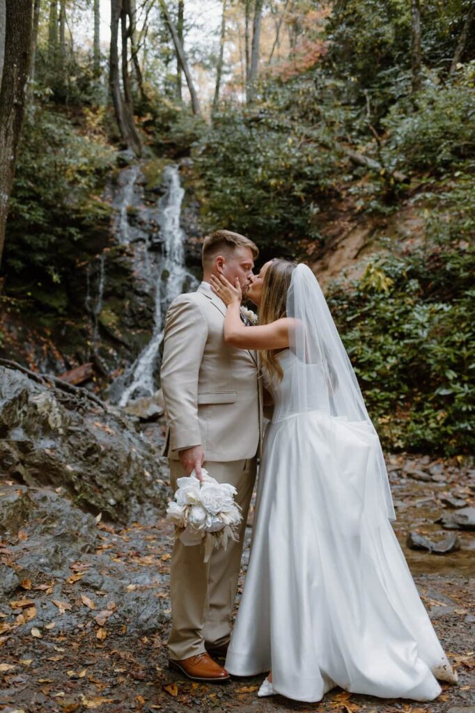 Couple shares their first kiss as husband and wife at their Great Smoky Mountain elopement.