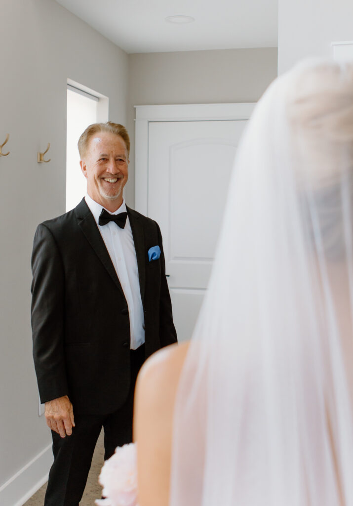 First look with the bride and the father of the bride at The Loyston Wedding Venue.