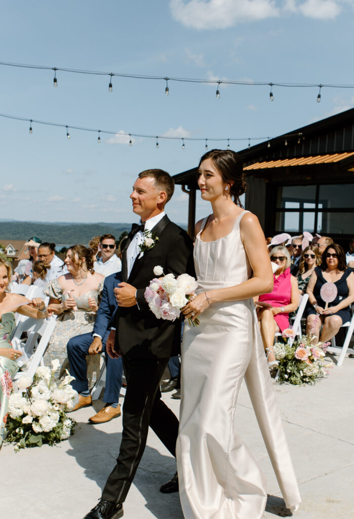 Bridal party walking down the aisle at the Loyston Wedding venue.