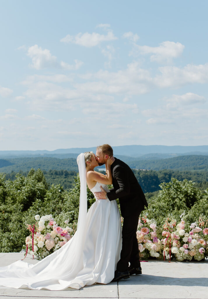 Bride and groom first kiss at the Loyston Wedding Venue.