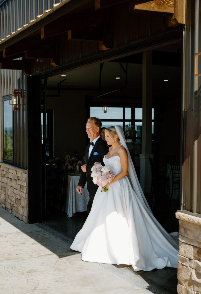 Bride walking down the aisle at the Loyston Wedding venue.