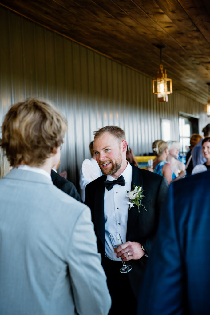 Candid moment of the groom at The Loyston Wedding Venue.