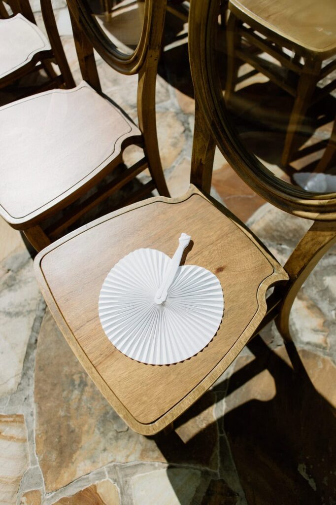 Hand held fan for guests during a summer wedding. This is a thoughtful inclusion for hot ceremonies. 