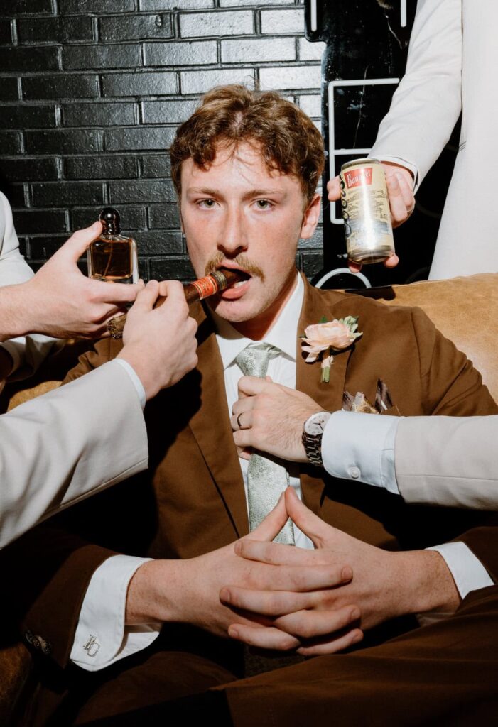 Creative groom's portrait with cologne, beer, and cigar at Nichols Heir.
