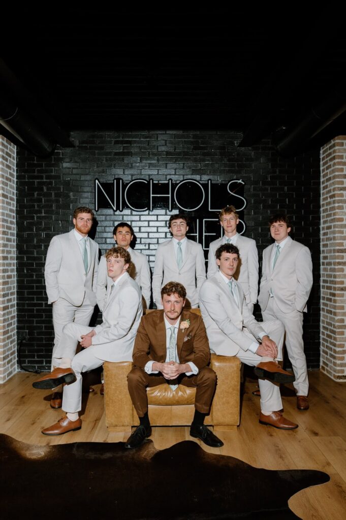 Groom and his groomsmen portrait in the groom's suite.