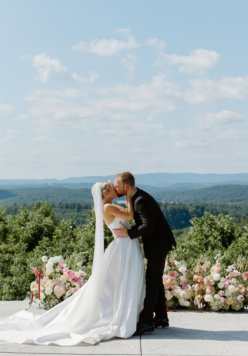 Bride and groom first kiss at the Loyston Wedding Venue.
