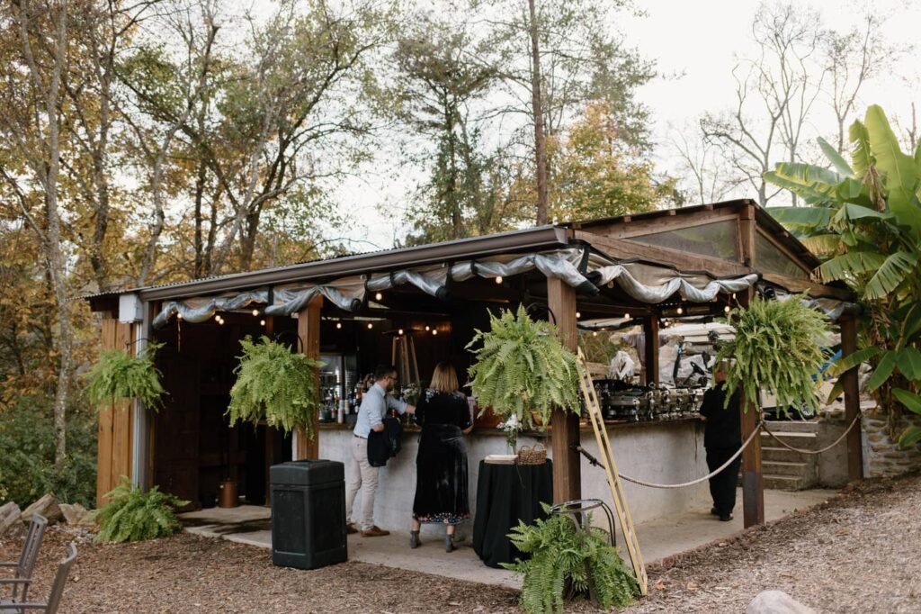 Outdoor bar setup at fall wedding at Ancient Lore Village, Knoxville wedding venue.