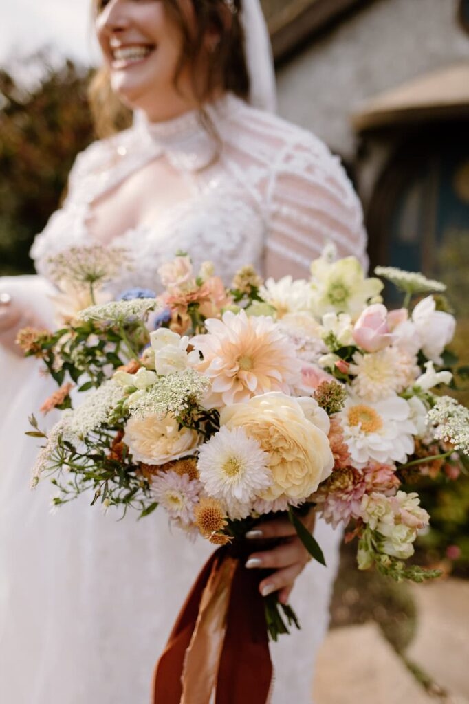 Romantic fall wedding bouquet full of whimsical butter yellow florals.