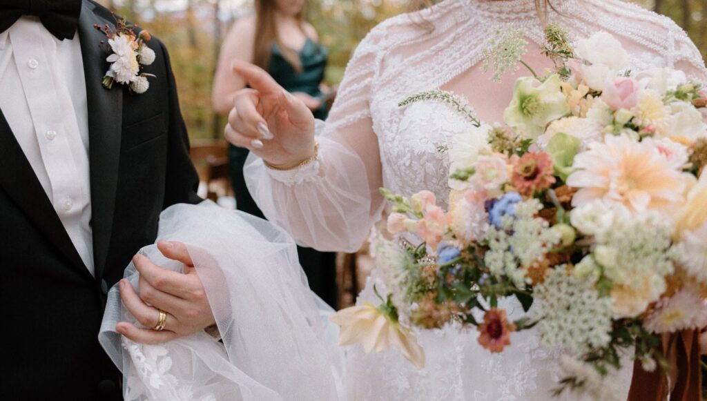 Bride and groom fall wedding attire details at Ancient Lore Village, Knoxville wedding venue.