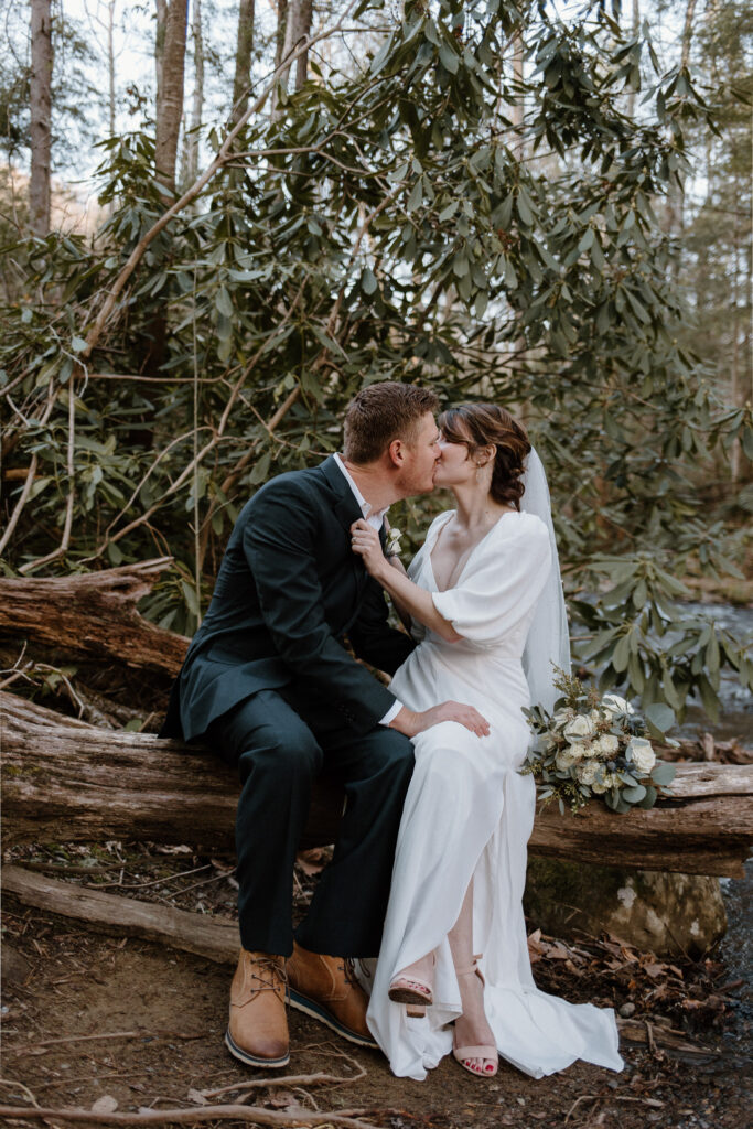 Intimate bride and groom portraits at Cataract Falls for their forest elopement.